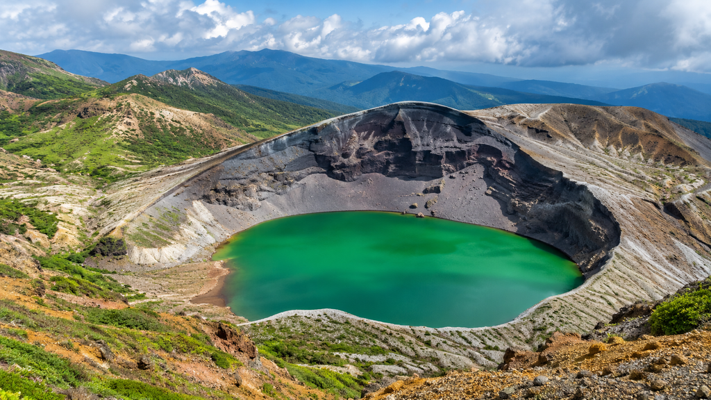 Emerald water of the Okama volcanic crater lake on Mount Zao in Miyagi